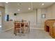 Basement dining area with custom wood table and chairs, with a built-in hutch at 1166 Belgian Trl, Elizabeth, CO 80107