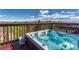Relaxing hot tub on a deck overlooking a scenic open field, perfect for outdoor enjoyment at 1166 Belgian Trl, Elizabeth, CO 80107