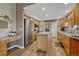 Spacious kitchen with wood cabinets, stainless steel appliances, and center island at 1166 Belgian Trl, Elizabeth, CO 80107
