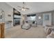 Relax in this living room with a cozy fireplace, vaulted ceilings, and plush carpeting at 1166 Belgian Trl, Elizabeth, CO 80107