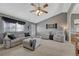 Inviting living room features vaulted ceilings, neutral paint, plush carpeting, and comfortable seating at 1166 Belgian Trl, Elizabeth, CO 80107
