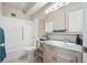 Bathroom with vanity, sink, mirror, toilet, and bathtub with shower head at 655 S Alton Way # 5C, Denver, CO 80247