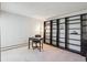 Bright room features a large shelving unit and a spot for a desk at 655 S Alton Way # 5C, Denver, CO 80247