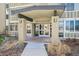 Inviting building entrance with prominent signage and well-maintained landscaping at 655 S Alton Way # 5C, Denver, CO 80247