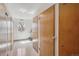 Hallway with wooden storage closets and a small window for natural light at 655 S Alton Way # 5C, Denver, CO 80247