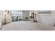 Spacious living room with sliding doors to a balcony and views, plus artist's easel at 655 S Alton Way # 5C, Denver, CO 80247