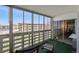 Bright sunroom with large windows overlooking a green landscape at 655 S Alton Way # 5C, Denver, CO 80247