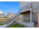 A spacious backyard features a modern deck with stairs, providing an ideal spot for outdoor gatherings at 10200 Xanadu St, Commerce City, CO 80022
