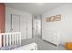 Well lit bedroom features a closet, white dresser, and gray carpet at 10200 Xanadu St, Commerce City, CO 80022