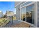 A cozy deck features a sliding glass door and modern railings, perfect for enjoying the outdoors at 10200 Xanadu St, Commerce City, CO 80022