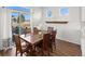 Cozy dining room boasts a wooden table with seating for six and sliding glass doors at 10200 Xanadu St, Commerce City, CO 80022