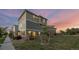 Charming two-story home with landscaped yard and a modern exterior paint scheme at 10200 Xanadu St, Commerce City, CO 80022
