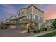 Charming home with a covered front porch, a well-manicured lawn, and inviting curb appeal at 10200 Xanadu St, Commerce City, CO 80022