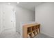 Upstairs hallway with gray carpet and shelving unit at 10200 Xanadu St, Commerce City, CO 80022