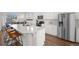 Bright kitchen with white cabinetry, stainless steel appliances, and an expansive center island at 10200 Xanadu St, Commerce City, CO 80022