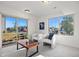 Bright living room with sliding glass doors that lead to the backyard and view of neighborhood at 10200 Xanadu St, Commerce City, CO 80022