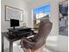 Well-lit office space with large window, desk, and comfortable leather chair at 10200 Xanadu St, Commerce City, CO 80022