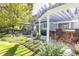 Beautiful backyard with a pergola, bar area, seating, and lush landscaping for outdoor enjoyment at 4483 W Cottonwood Pl, Littleton, CO 80123