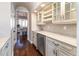 Convenient bar area featuring built-in wine racks, a sink, and beverage cooler, perfect for entertaining at 4483 W Cottonwood Pl, Littleton, CO 80123