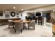 Finished basement featuring a bar area, game table, and ample seating for entertaining at 4483 W Cottonwood Pl, Littleton, CO 80123