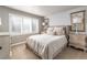 Relaxing bedroom with neutral tones, a large window with shutters, and elegant furnishings at 4483 W Cottonwood Pl, Littleton, CO 80123