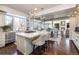 Spacious kitchen featuring an island, stainless steel appliances, and an open layout to the dining area at 4483 W Cottonwood Pl, Littleton, CO 80123