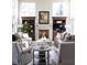 Bright living room with a fireplace, built-in shelves, and large windows providing natural light at 4483 W Cottonwood Pl, Littleton, CO 80123