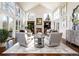 Bright living room with fireplace, vaulted ceiling, and large windows at 4483 W Cottonwood Pl, Littleton, CO 80123