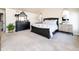 Spacious main bedroom with a carpeted floor and natural light, along with stylish furniture at 4483 W Cottonwood Pl, Littleton, CO 80123