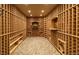 Spacious wine cellar with custom wood racking and stone flooring at 4483 W Cottonwood Pl, Littleton, CO 80123