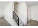 A modern staircase with metal railing at 22113 E 38Th Pl, Aurora, CO 80019