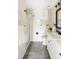 Modern bathroom features a walk-in shower and white vanity with black fixtures at 3600 S Pierce St # 7-201, Denver, CO 80235