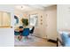 Bright dining room with round table and comfortable seating at 3600 S Pierce St # 7-201, Denver, CO 80235