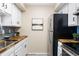 Kitchen with butcher block countertops, stainless steel appliances, and blue tile backsplash at 3600 S Pierce St # 7-201, Denver, CO 80235