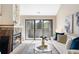 Inviting living room features a fireplace, sliding glass doors, and comfortable seating at 3600 S Pierce St # 7-201, Denver, CO 80235