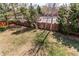 Spacious backyard featuring a brick wall, mature trees, and a well-maintained lawn at 9754 Las Colinas Dr, Lone Tree, CO 80124