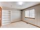 Well lit bedroom with closet and window, offers a relaxing space at 9754 Las Colinas Dr, Lone Tree, CO 80124
