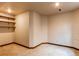Bonus room with neutral carpet, trim, and wall color, complemented by convenient built-in shelving at 9754 Las Colinas Dr, Lone Tree, CO 80124