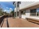 Expansive wood deck with black metal railing, showcasing outdoor seating and home exterior at 9754 Las Colinas Dr, Lone Tree, CO 80124