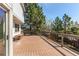 Spacious wooden deck featuring iron railing and bench seating, perfect for outdoor entertaining at 9754 Las Colinas Dr, Lone Tree, CO 80124