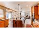 Open kitchen boasts a center island with granite countertop, and adjacent breakfast nook and cozy living room at 9754 Las Colinas Dr, Lone Tree, CO 80124