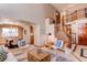 Bright living room showcases a staircase, dining area, and stylish decor, perfect for entertaining at 9754 Las Colinas Dr, Lone Tree, CO 80124