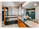 Elegant main bathroom with large soaking tub, shower, double vanity, and plenty of natural light at 9754 Las Colinas Dr, Lone Tree, CO 80124