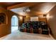 Home theater with tiered seating, plush leather chairs, and a projector for the ultimate movie-watching experience at 9754 Las Colinas Dr, Lone Tree, CO 80124