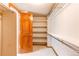 Spacious walk-in closet with adjustable shelving and rod, perfect for organizing clothes and accessories at 9754 Las Colinas Dr, Lone Tree, CO 80124