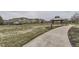 Well-maintained community park with walking paths, a gazebo, and residential buildings in the background at 9519 Pearl Cir # 105, Parker, CO 80134