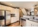 Modern kitchen with stainless steel appliances and sleek countertops at 9519 Pearl Cir # 105, Parker, CO 80134