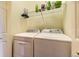Laundry room featuring a side-by-side washer and dryer, wire shelving, and light colored walls at 9519 Pearl Cir # 105, Parker, CO 80134