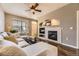 Comfortable living room with fireplace, perfect for relaxing at 9519 Pearl Cir # 105, Parker, CO 80134