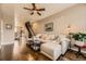 Spacious living room featuring hardwood floors and staircase at 9519 Pearl Cir # 105, Parker, CO 80134